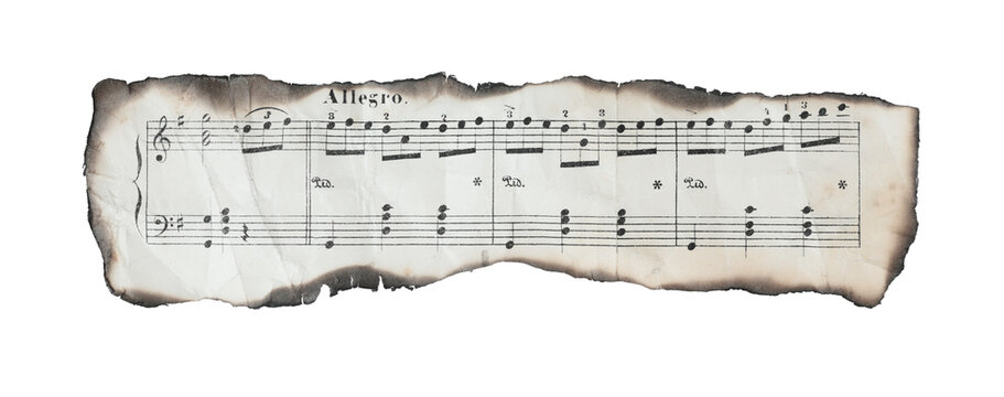 Burnt and crumpled horizontal fragment of music sheet with visible staff lines and notes. Concept of damaged composition, loss, or creative tension. Isolated on transparent background