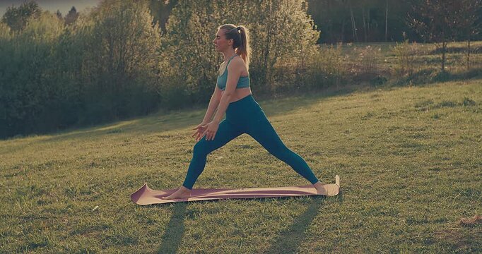 Woman Practicing Yoga in Park on Sunny Spring Day, Outdoor Wellness and Mindfulness Concept