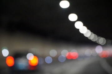 Modern Car Drives Through Tunnel with Bright Lights