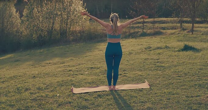 Woman Practicing Yoga in Park on Sunny Spring Day, Outdoor Wellness and Mindfulness Concept
