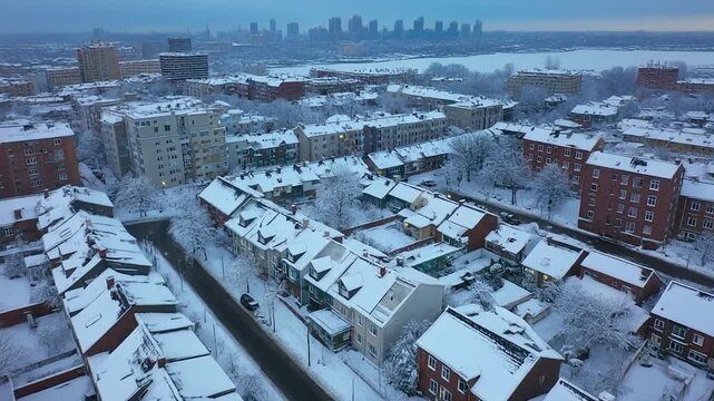 Winter Cityscape: Aerial View of Snow-Covered Houses & Skyline
