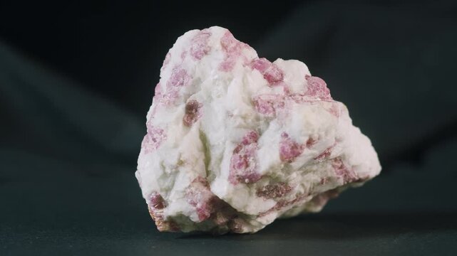 Pink tourmaline rubellite in snow quartz on black background