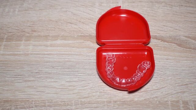 Clear dental aligner for orthodontics. Dental splint broken due to use.
