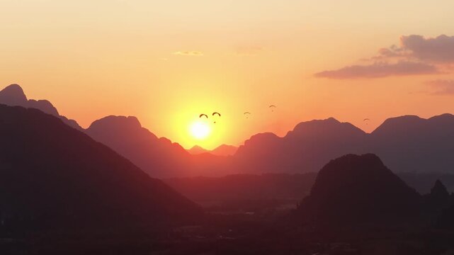 Sunset Paragliding Over Vang Vieng Mountains