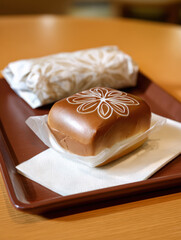A tray displays a fruit sando featuring a simple flower design. 