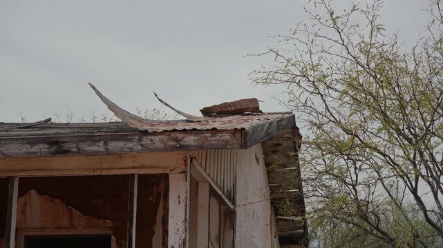 Roofing tin flapping in the breeze on an abandoned building