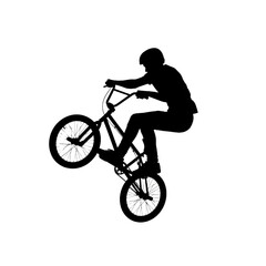 Obraz premium Silhouette of a BMX rider performing a trick on a bicycle, capturing extreme sports and action