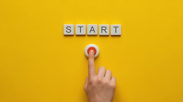 Hand pressing start button, finger on red button, beginning concept, yellow background