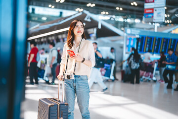 Portrait beautiful adult asian woman using smartphone buying travel insurance claim protect at airport terminal transport © dodotone