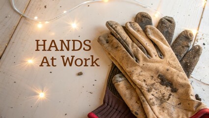 Hands Engaged in Work with Dirty Gloves and Twinkling Lights