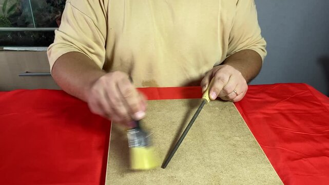 a man chooses things while sitting at a table