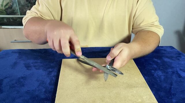 a man chooses things while sitting at a table