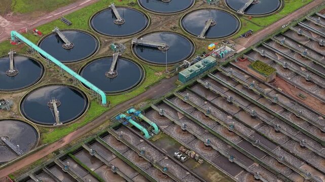 Aerial view of the Severn Trent Water plant, with tanks of varying sizes and shapes, displaying a complex industrial landscape, Severn Trent Wanlip, Leicester, United Kingdom.
