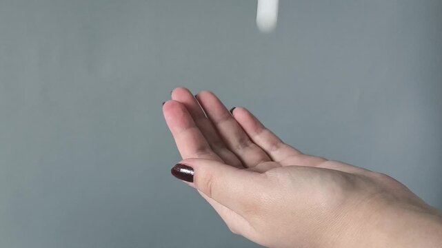 The pills are pouring into my arm. Taking tablets, vitamins. Treatment of diseases. ARVI. ARI. Uncontrolled pill intake concept