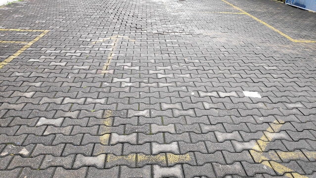 A close up view of the durable interlocking paver blocks showing the precise geometric pattern of the bricks.