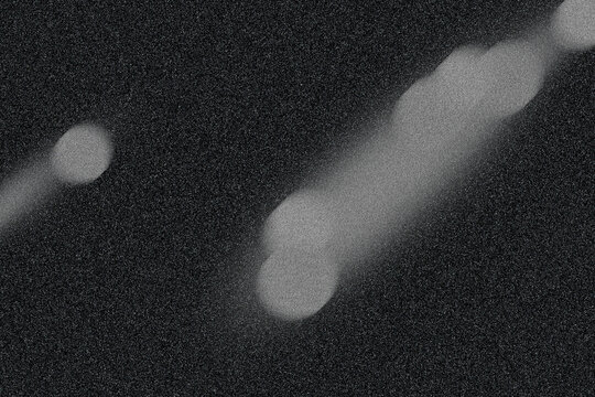 Grainy Motion Blur Gray Bokeh Effect with Dark Textured Background