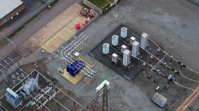 Aerial view of the Enderby Substation National Grid with its mix of blue transformers and silver electrical equipment, Enderby, Enderby, United Kingdom.