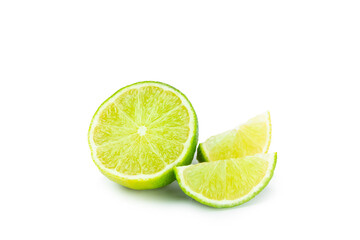 Fresh lime isolated on white background. Whole limes and slices in a bowl. Citrus. Vitamin C. Detox diet. Tropical fruits. Summer refreshing lemonade or mojito concept.