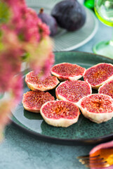 Delicious fresh fig carpaccio with burrata or stracciatella or mozzarella cheese and arugula salad