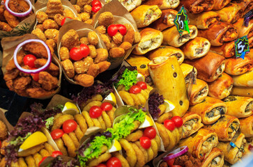 Stall selling a variety of delicious snacks at a street market in Barcelona, ​​Spain