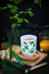 Cozy ceramic cup of cofee on spring background