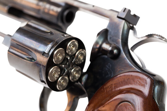 Loaded revolver cylinder close-up on white background