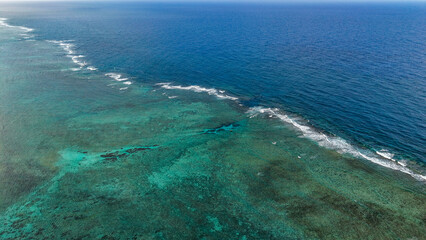 Fototapeta premium Scenic aerial drone photography of the island of Rodrigues coast. Beautiful lagoon of the island of Rodrigues, Mauritius, taken from above .Indian ocean coral reef 
