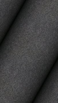 Charcoal Brushed Cashmere Fabric Texture in Soft Rolls Rotation with Luxurious Fiber Detail as Premium Background
