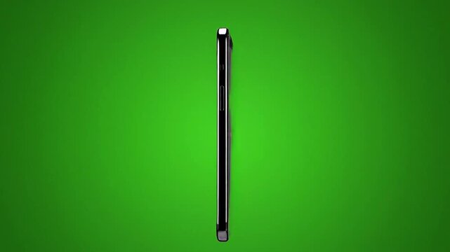 Smartphone rotating with a blank green screen for video mockup and app display on chroma key background