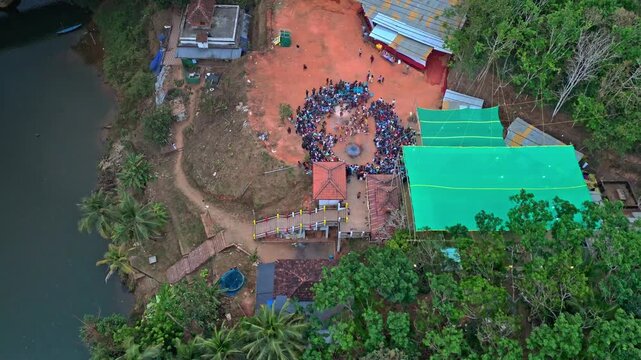 Drone footage capturing Theyyam performance inside a sacred Kavu temple in North Malabar Kerala.