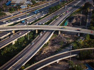 Obraz premium Aerial view modern city asphalt transport junction x cross road with vehicle movement