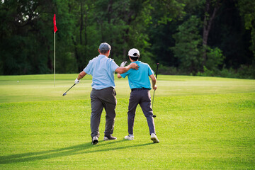 Fototapeta premium Golf Game Between Father and Son Bonding on Green Course With Smile and Connection in Natural Outdoor Setting