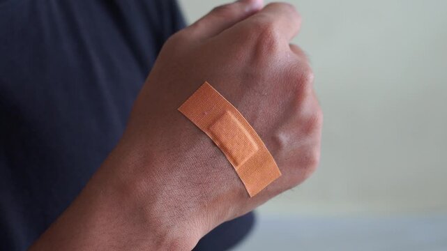 Man hand with a band aid