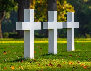 Serene Memorial: Three White Crosses in a Cemetery on a Sunny Autumn Day
