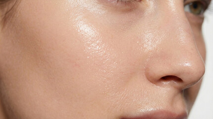 Fototapeta premium Macro shot of clean healthy female skin with natural glow and moisture texture for skincare beauty concept