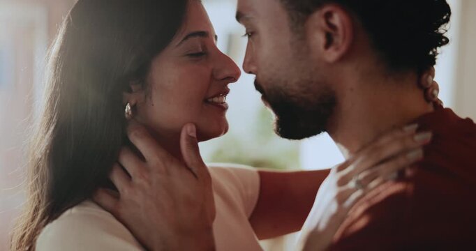 Kiss, love and couple in home with care, connection and support with partner on valentines day. Forehead touch, happy man and woman with loyalty, marriage commitment and romantic relationship