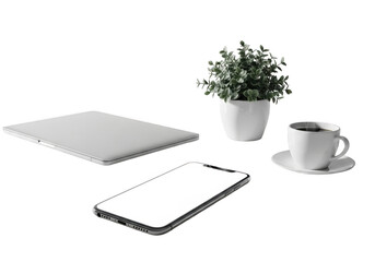 Notebook and laptop with green plant on office desk surrounded by technology and business items
