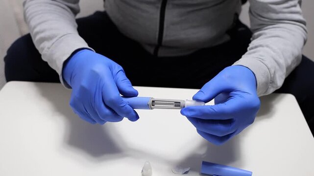 Man preparing semaglutide injection for weight loss and diabetes.