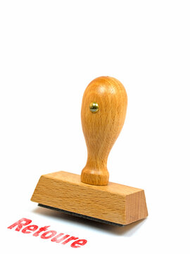 Holzstempel mit dem Text Retoure