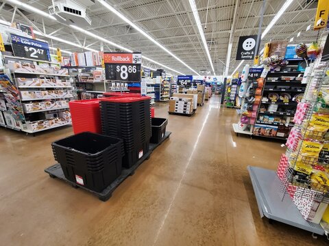 Bechtelsville, Pennsylvania, U.S - Jan 30, 2026 - Walmart retail aisle displaying storage bins, kitchen items, and craft supplies with rollback and low‑price promotions.