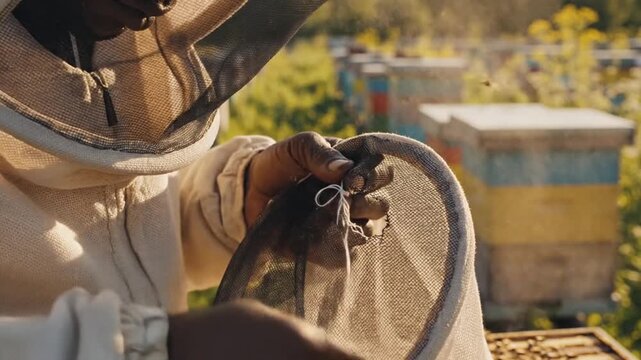Close-up of hands holding a model train controller outdoors