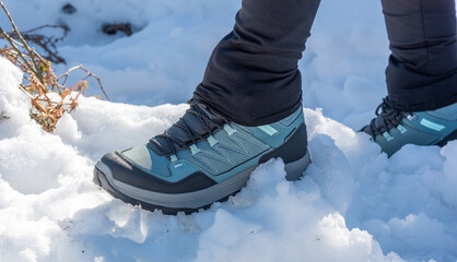 Close Up of a Hiking Boot Stepping on Snow