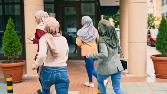 Four confident Muslim women friends smiling while running in the city, modest clothing, empowerment, diversity and inclusion concept, professional lifestyle stock photo, clean background, soft natural