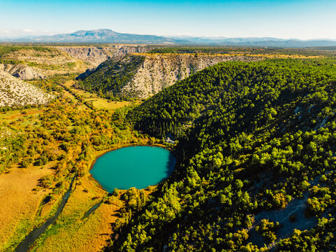 Aerial view of the confluence where the Cikola river lake drom torak view tributary joins the Krka river canyon, Krka National Park, Dalmatia, Croatia.