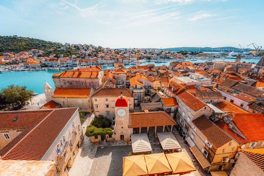 panoramic view over the historic red roofs of Trogir old town and the Adriatic sea from the bell tower of St. Lawrence Cathedral, Croatia.