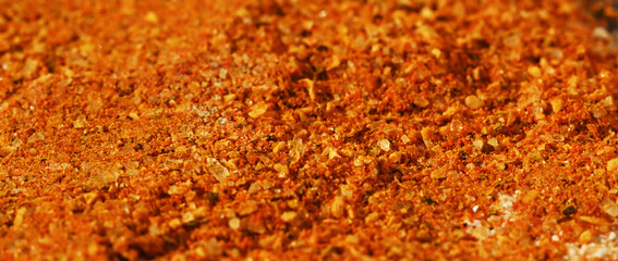 Close-up macro vibrant spice mix with orange tones