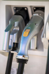 EV charger plugs at a public charging station.