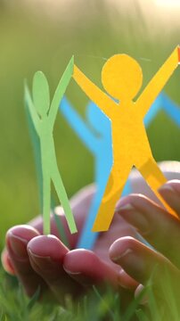 Silhouettes of people of different colors united. Help and protection concept
