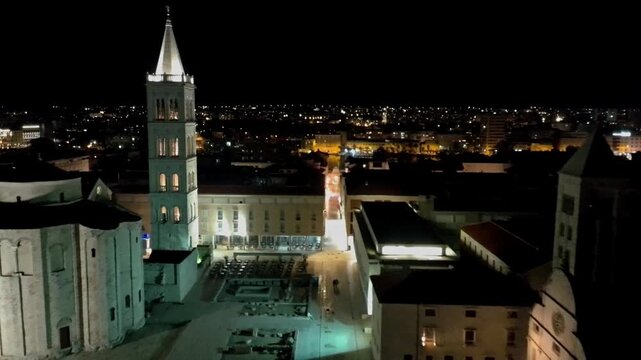 Aerial drone night view of the iconic circular Church of St. Donatus, one of Zadar s most famous pre Romanesque landmarks