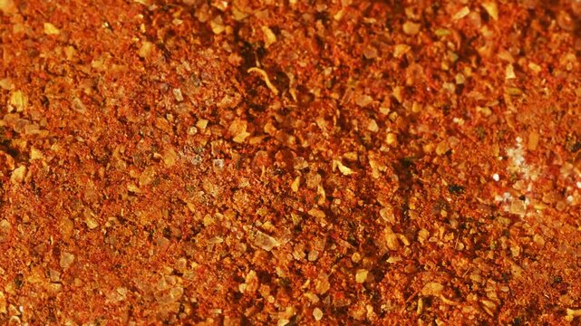 Close-up macro vibrant spice mix with orange tones
